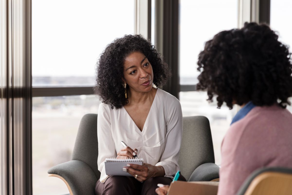 Therapist talking to an inpatient mental health patient