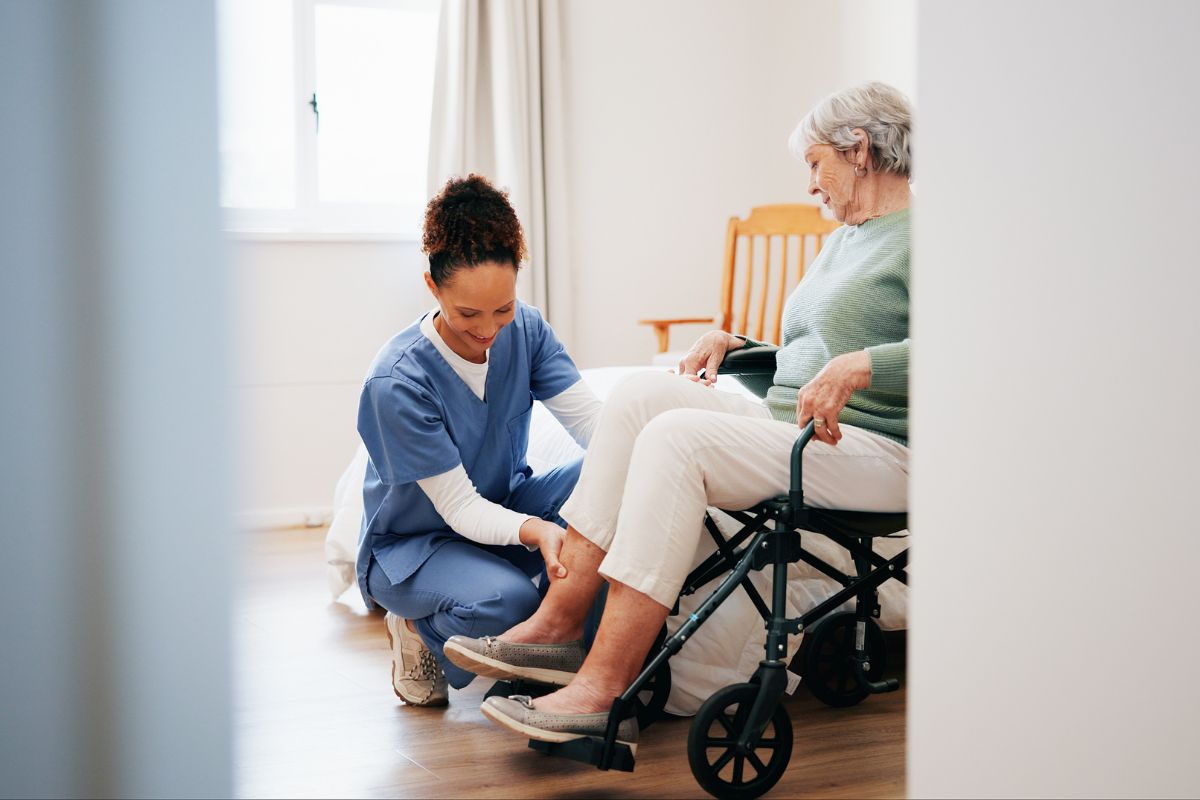 Healthcare worker helping a beneficiary at a skilled nursing facility